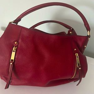 Michael Kors shoulder bag. Red in color. Very well maintained. Like New